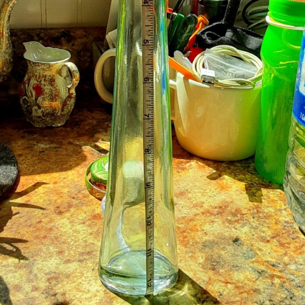 Clear green tinted stretch glass bottle/vase
